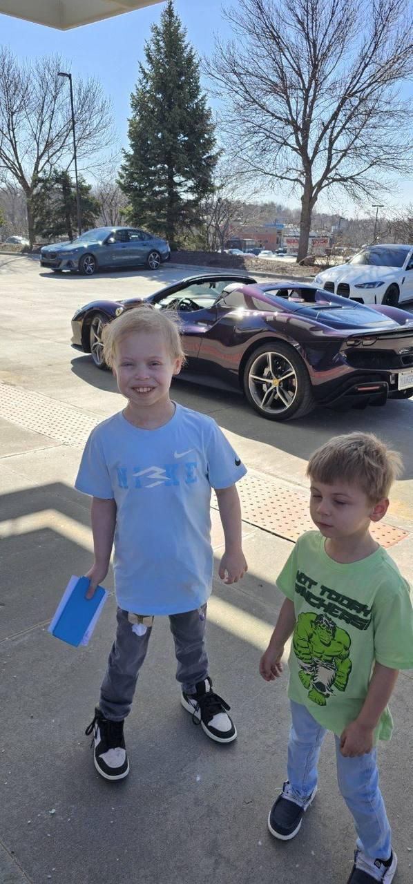 Aidenn outside the Ferrari, pure joy
